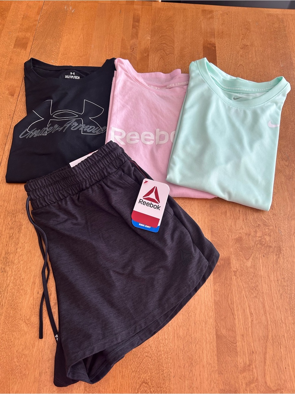 Lot of 4! Reebok shorts S NWT 3 athletic tees XS Reebok Nike Under Armour